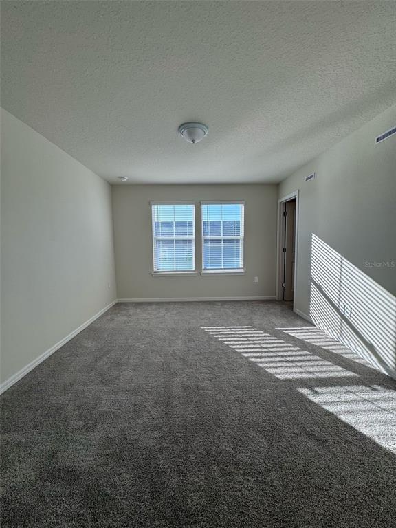 2710 Fetching Trail Davenport, FL 33896 - Photo 6 of 20 a view of an empty room with a window