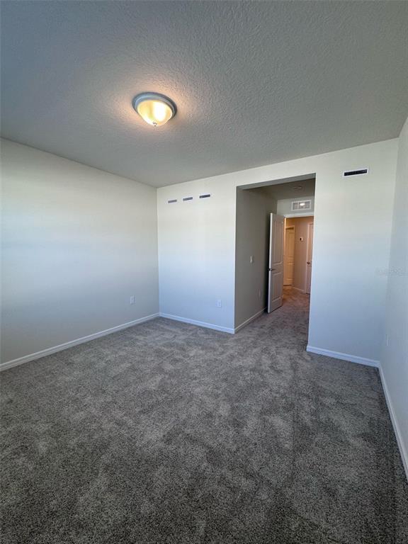 2710 Fetching Trail Davenport, FL 33896 - Photo 10 of 20 an empty room with a natural light