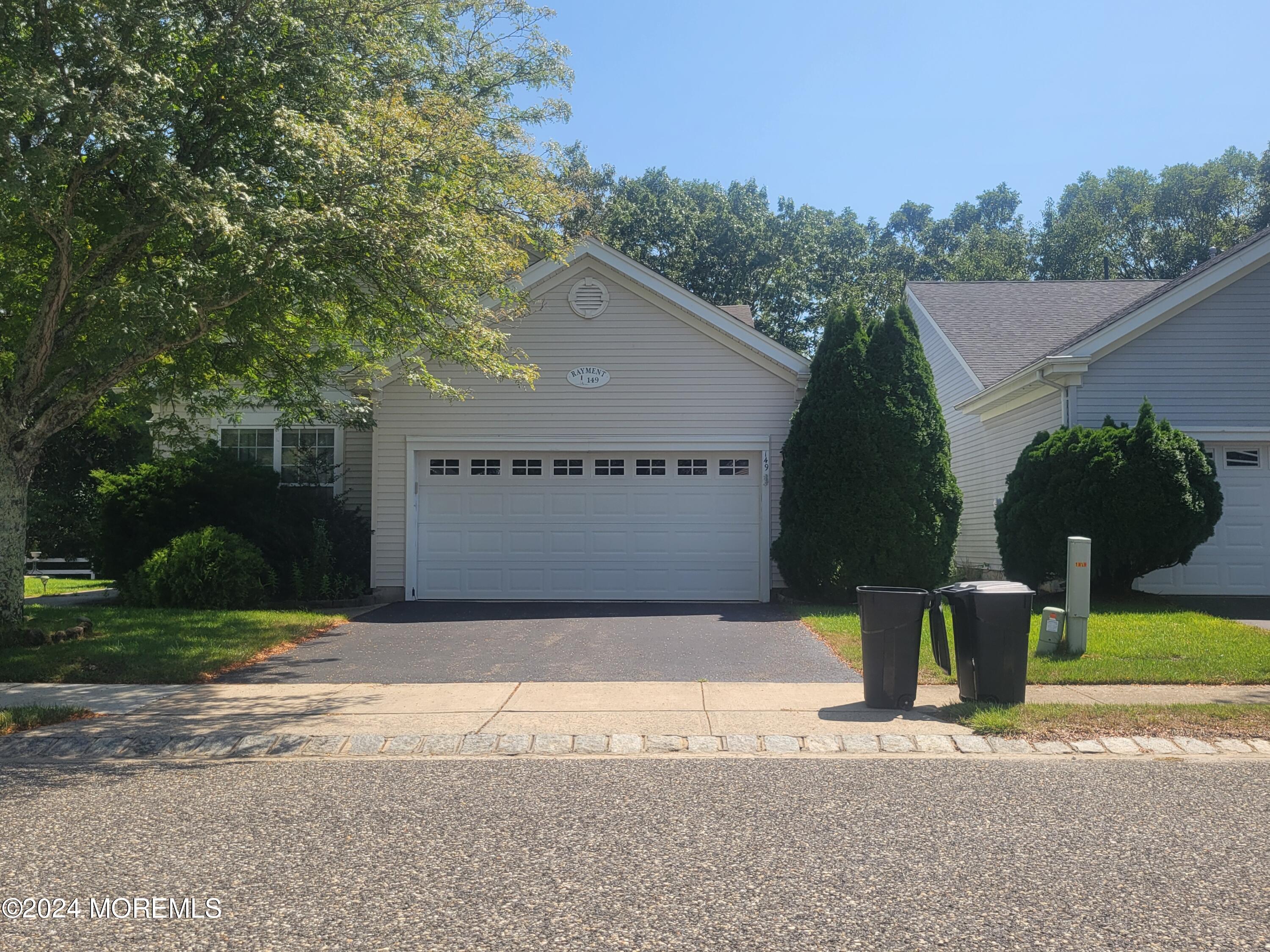 149 Sandpiper Road Barnegat, NJ 08005 - Photo 1 of 18 a view of a house with a yard and a garage