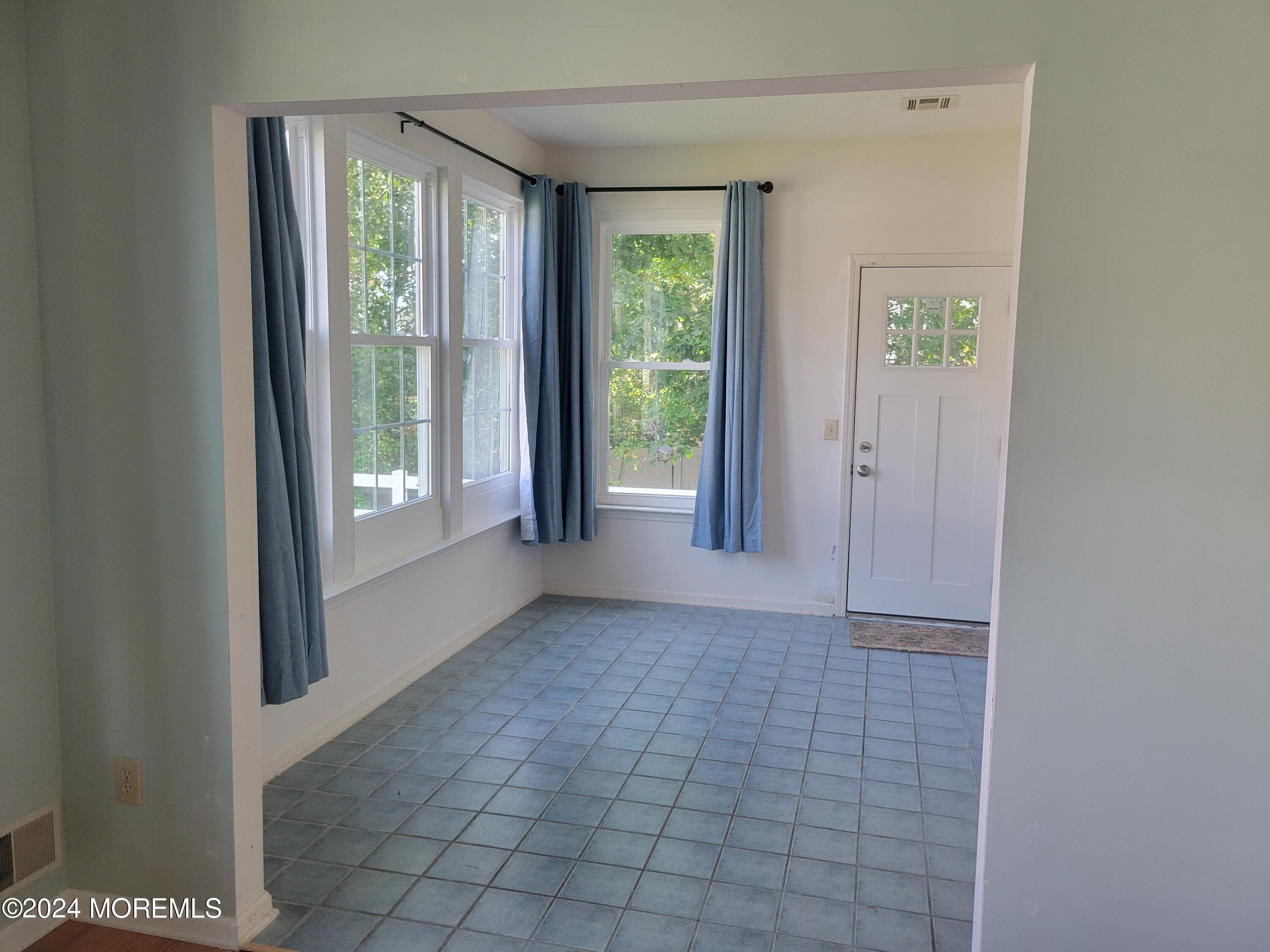 149 Sandpiper Road Barnegat, NJ 08005 - Photo 11 of 18 a view of an entryway with wooden floor and windows
