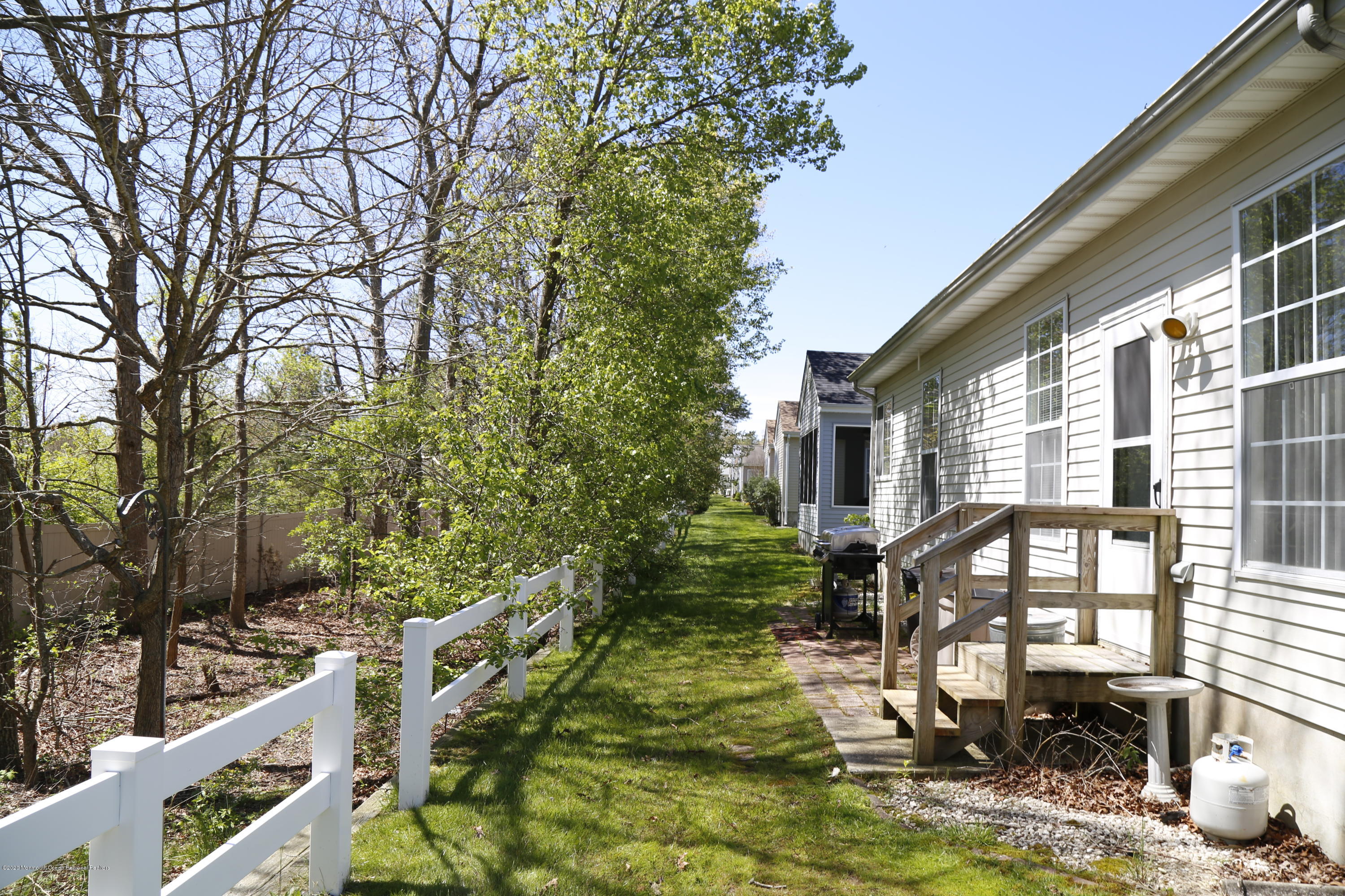 149 Sandpiper Road Barnegat, NJ 08005 - Photo 16 of 18 a view of a house with backyard and sitting area