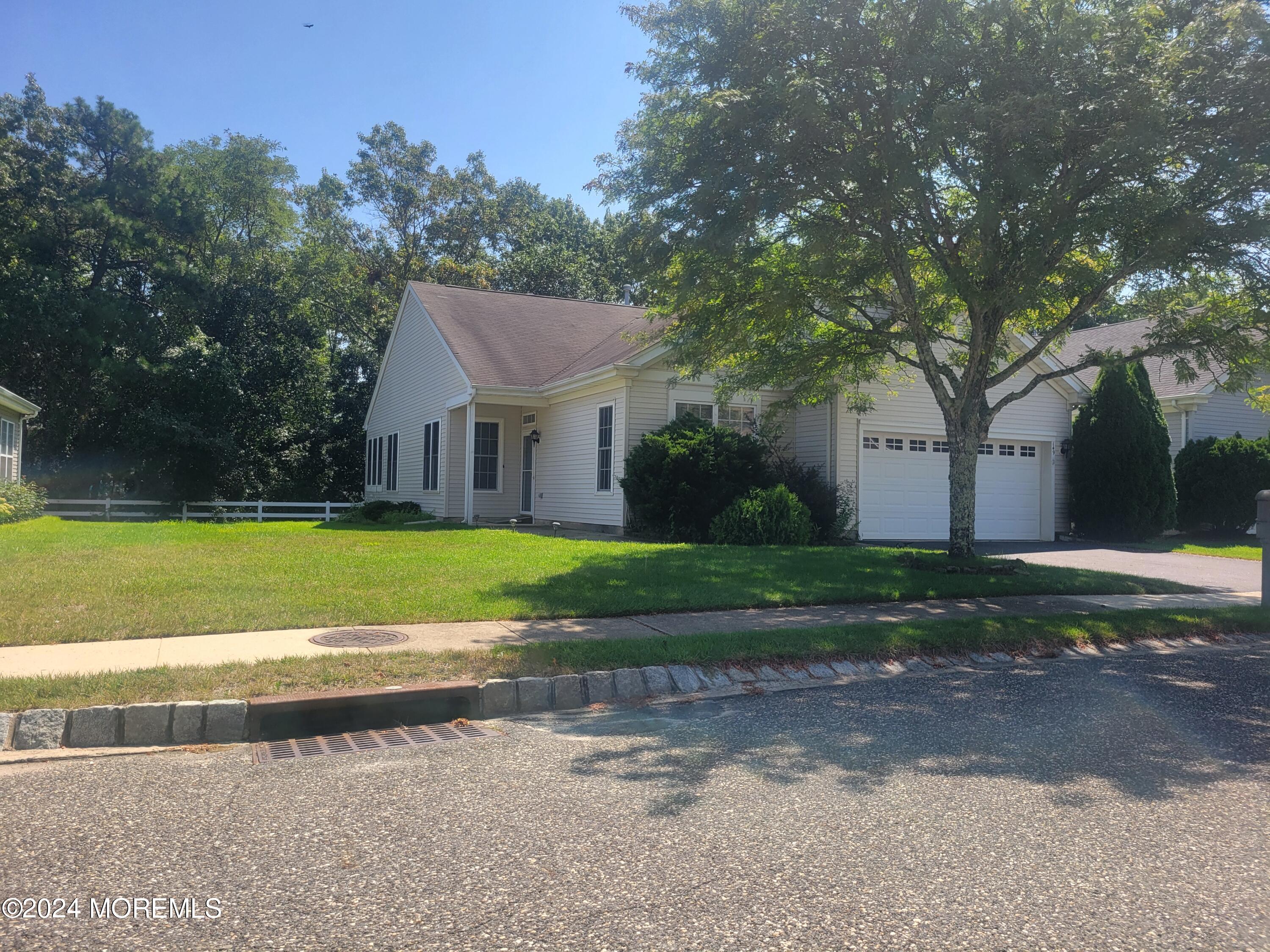 149 Sandpiper Road Barnegat, NJ 08005 - Photo 2 of 18 a view of a house with a big yard plants and large trees