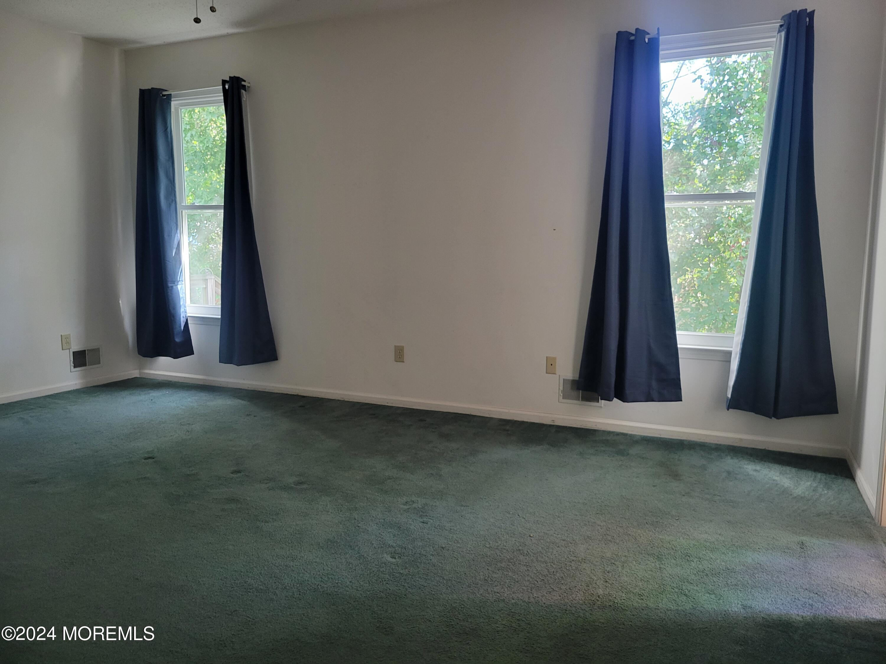 149 Sandpiper Road Barnegat, NJ 08005 - Photo 4 of 18 an empty room with windows