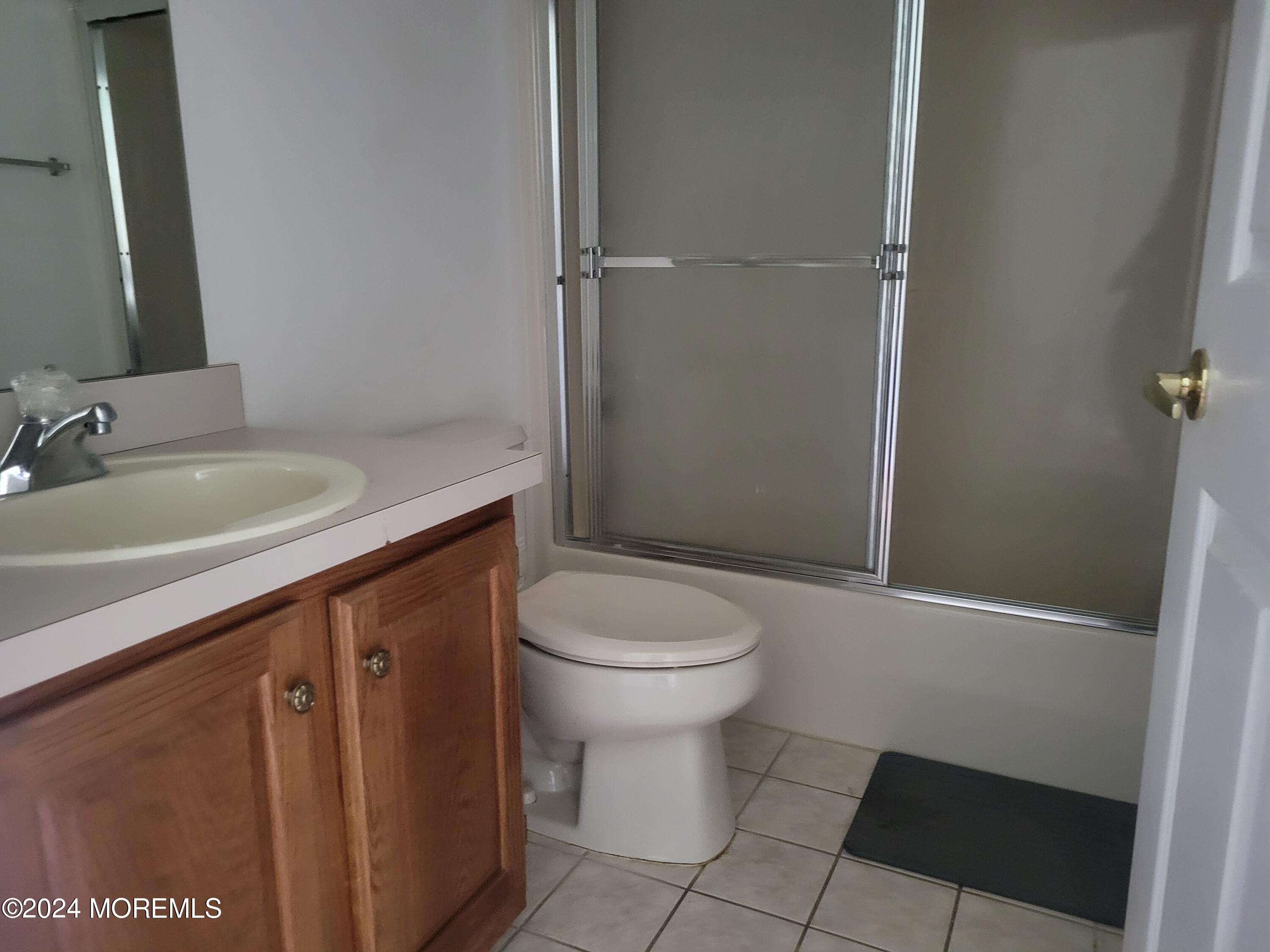 149 Sandpiper Road Barnegat, NJ 08005 - Photo 10 of 18 a bathroom with a sink a toilet and shower