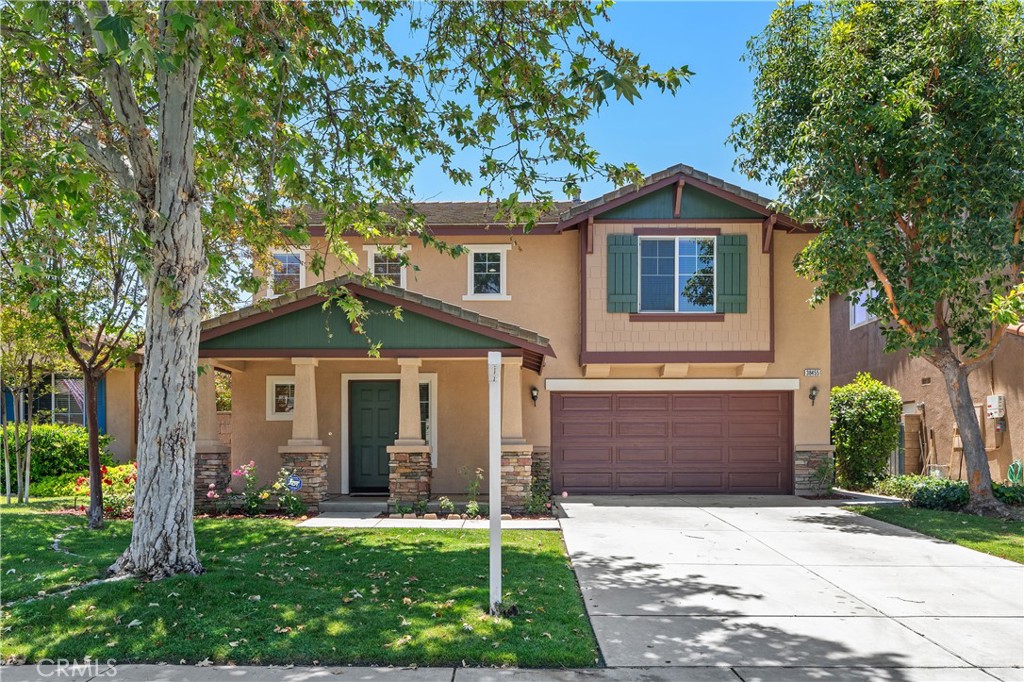 38455 Encanto Road Murrieta, CA 92563 - Photo 1 of 1 a front view of a house with a yard and garage
