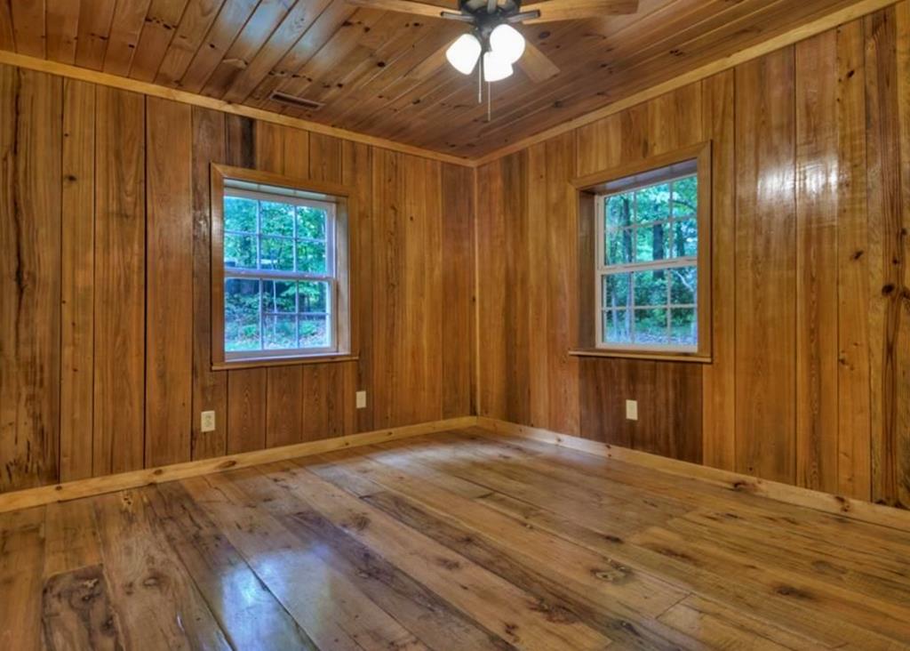 1843 Old Mobile Road McCaysville, GA 30555 - Photo 18 of 41 a view of an empty room with wooden floor and a window