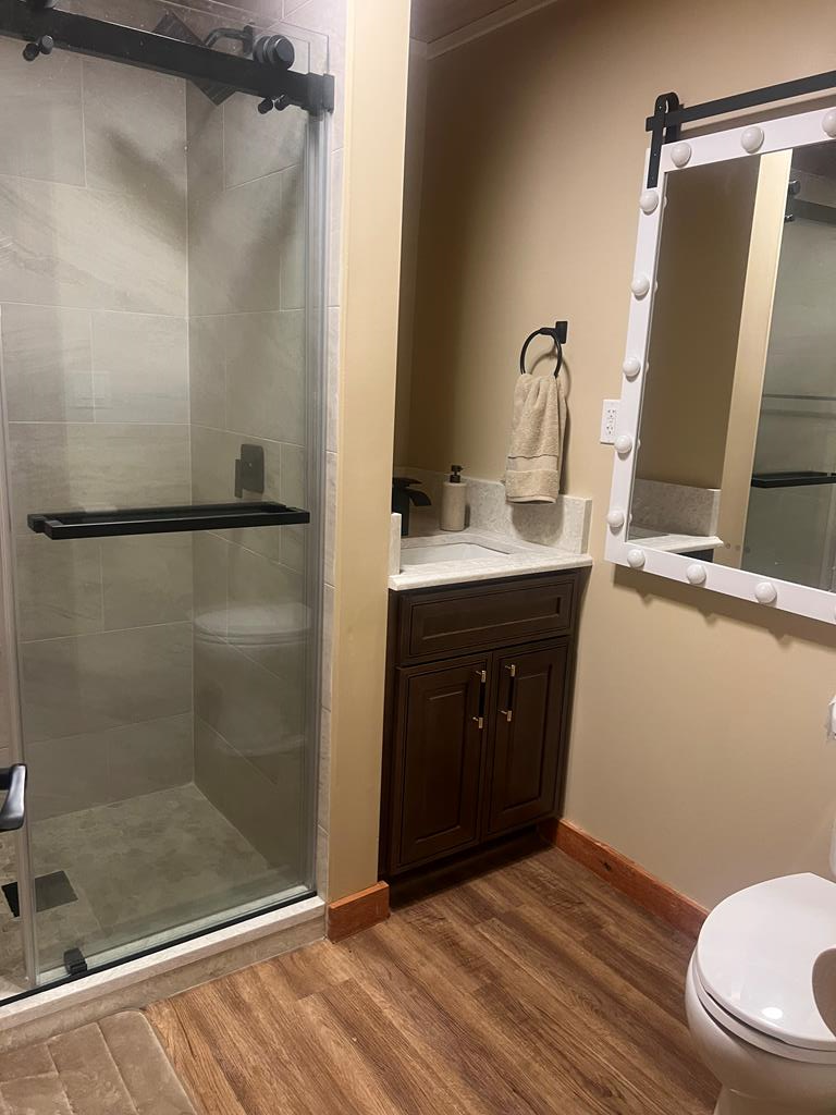 1843 Old Mobile Road McCaysville, GA 30555 - Photo 21 of 41 a bathroom with a sink a toilet and shower