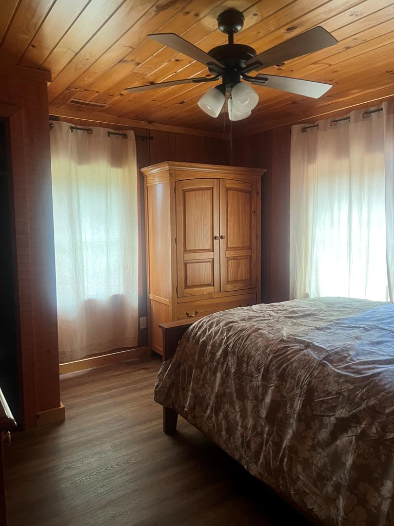 1843 Old Mobile Road McCaysville, GA 30555 - Photo 22 of 41 a bed sitting in a spacious bedroom next to a window