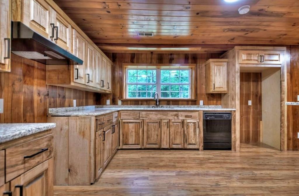 1843 Old Mobile Road McCaysville, GA 30555 - Photo 10 of 41 a kitchen with stainless steel appliances granite countertop a stove and a sink