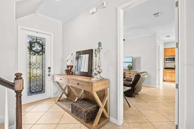 a kitchen with a stove window and cabinets