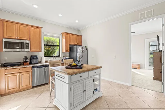 a kitchen with stainless steel appliances granite countertop a stove oven and a refrigerator