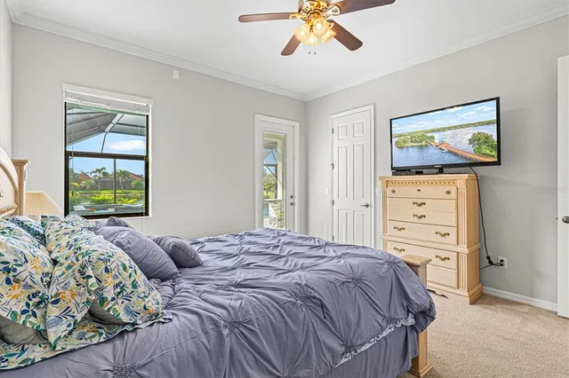 a spacious bedroom with a bed and a chandelier