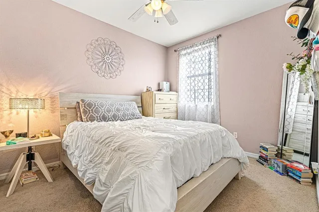 a view of a backyard with a patio and a garden