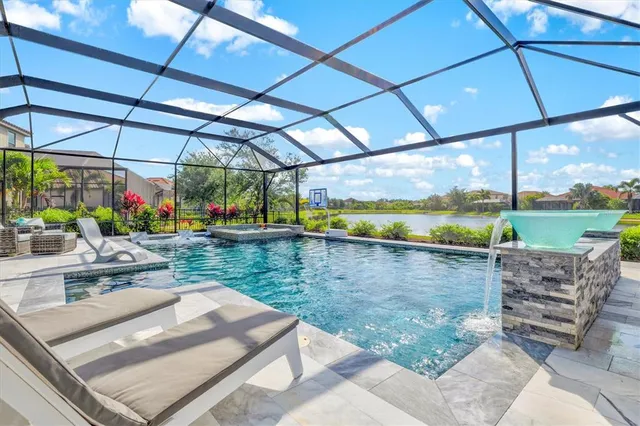 a view of a swimming pool with a patio