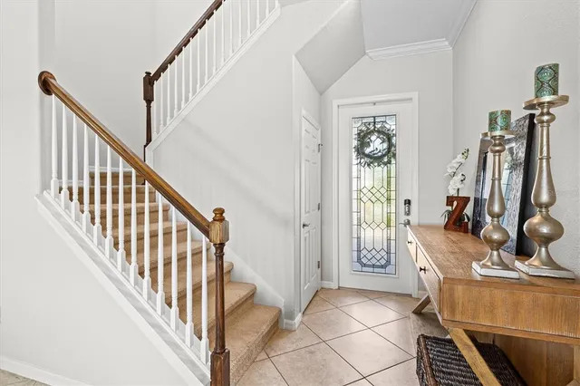 a view of a hallway with wooden floor and windows