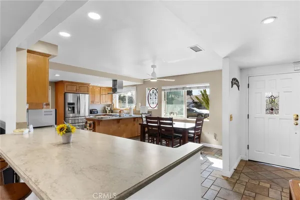 a view of a living room and kitchen