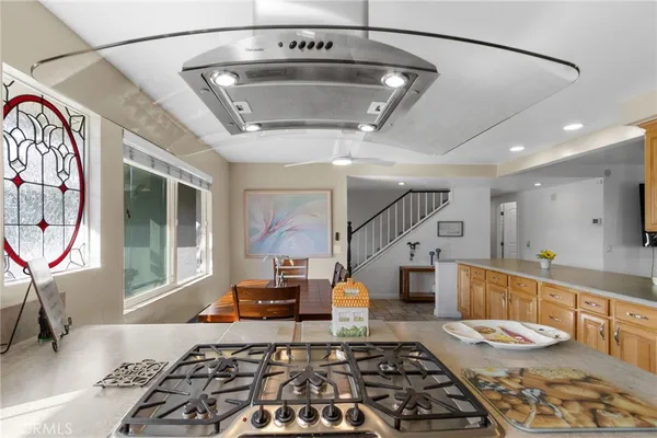 a kitchen with a refrigerator and a stove
