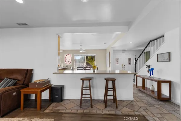 a kitchen with stainless steel appliances granite countertop a sink and cabinets
