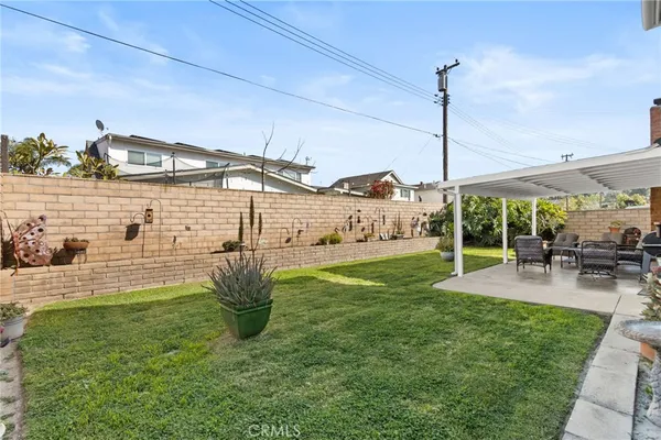 a backyard of a house with outdoor seating
