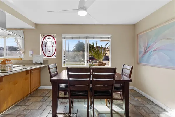 a dining room with furniture and window