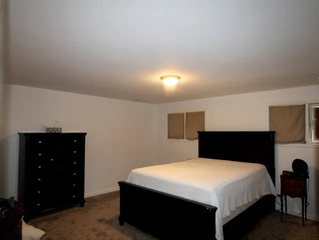 a bedroom with a bed and a closet