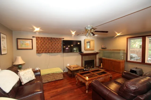 a living room with furniture and a fireplace