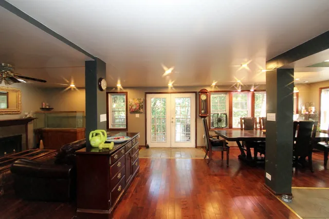 a living room with furniture and wooden floor