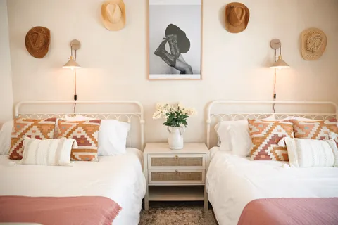 a bedroom with a bed and lamp