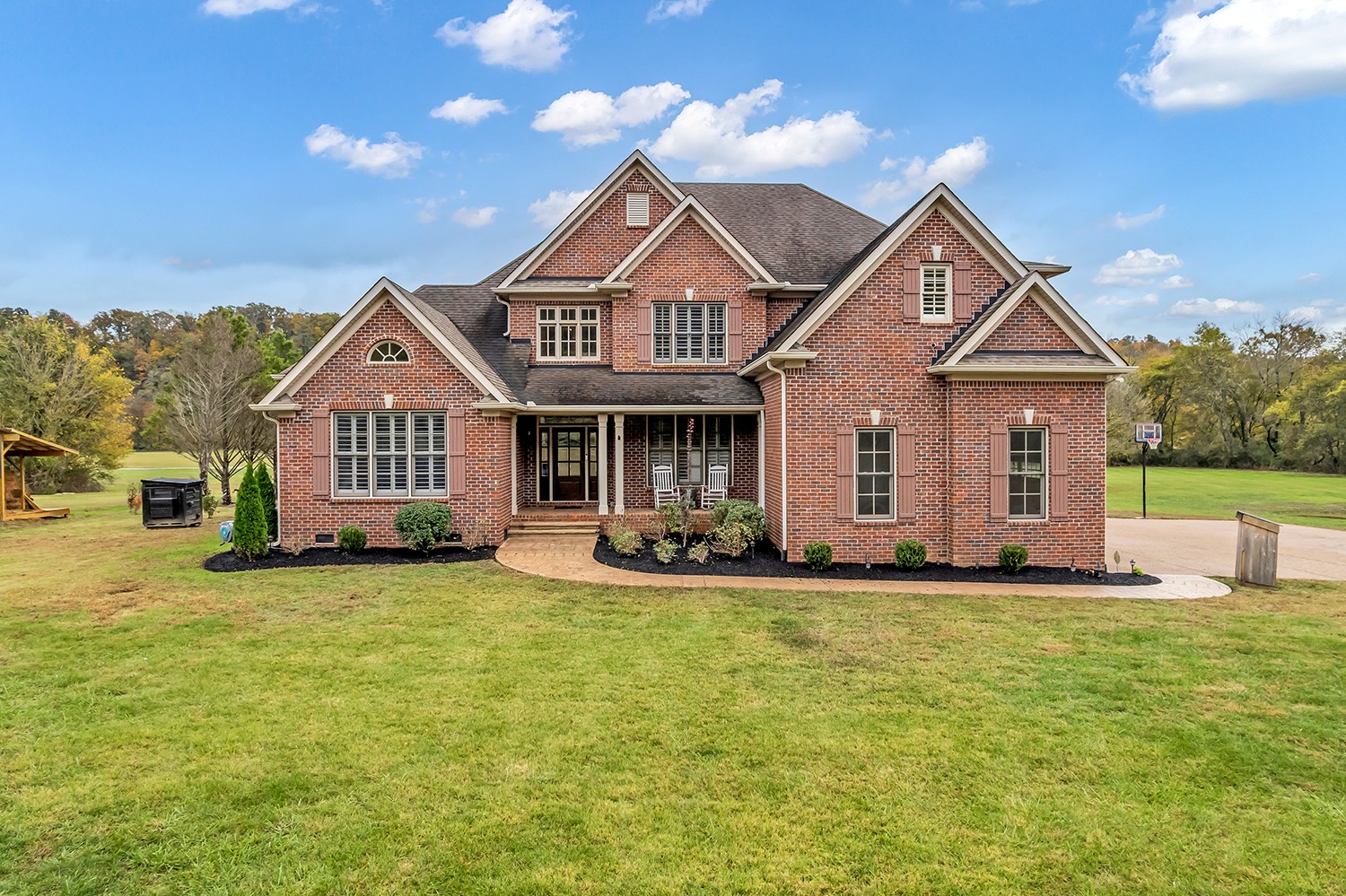 5210 Old Harding Road Franklin, TN 37064 - Photo 1 of 65 a front view of a house with a yard