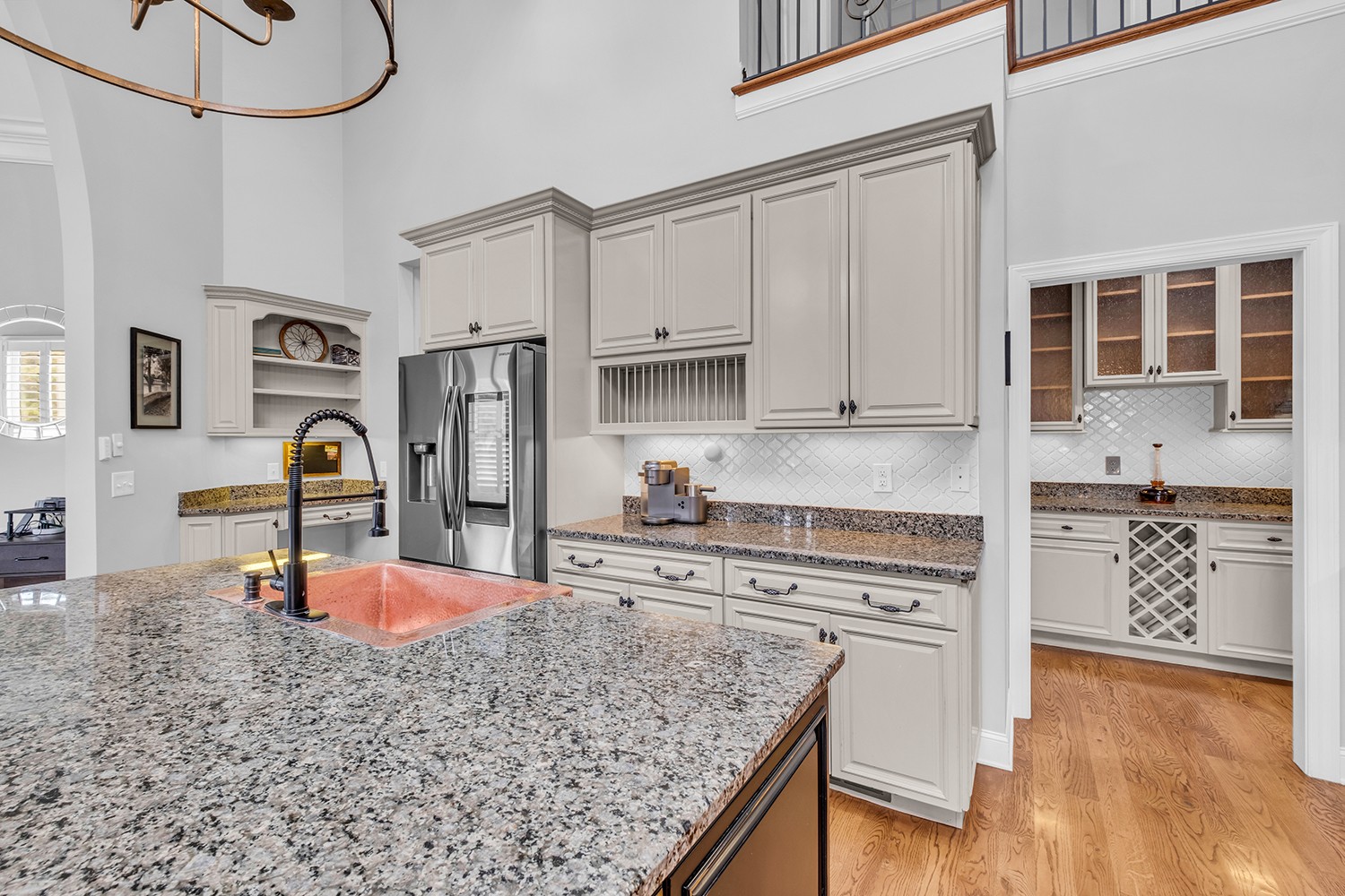 5210 Old Harding Road Franklin, TN 37064 - Photo 19 of 65 a kitchen with stainless steel appliances granite countertop a stove a sink and a refrigerator