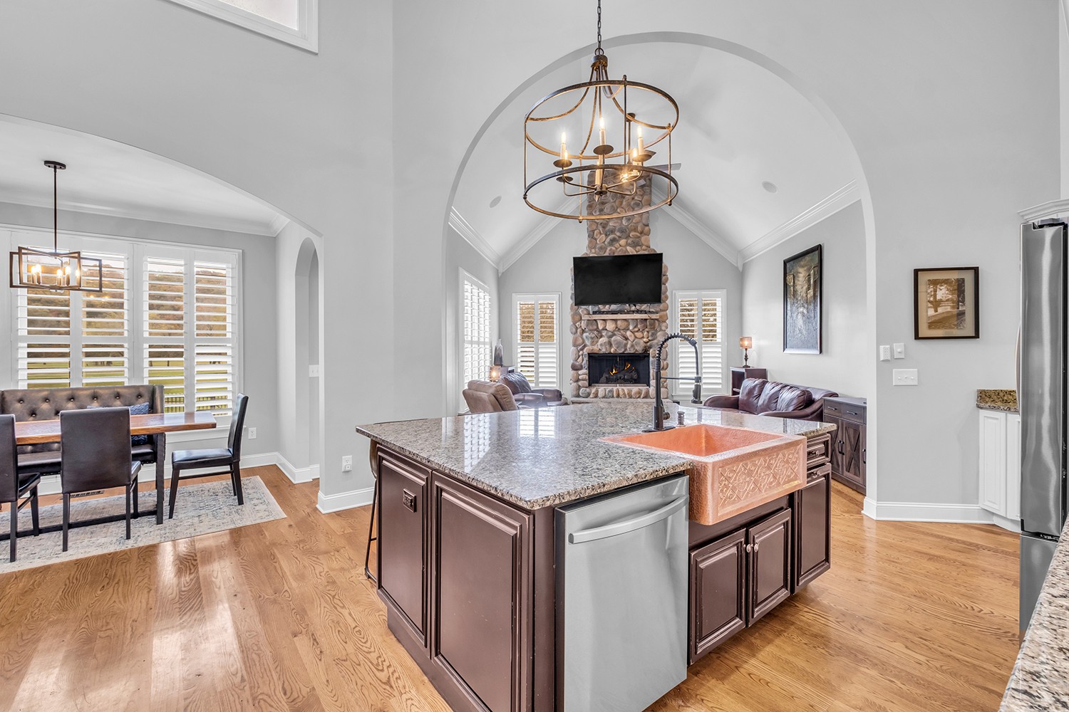 5210 Old Harding Road Franklin, TN 37064 - Photo 24 of 65 a room with stainless steel appliances granite countertop furniture a kitchen island a stove and a chandelier
