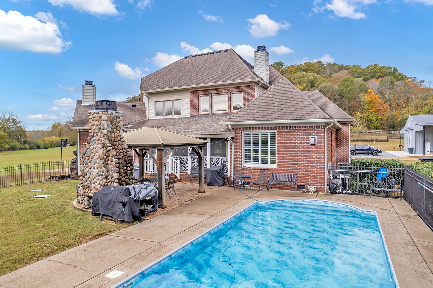 5210 Old Harding Road Franklin, TN 37064 - Photo 51 of 65 a front view of a house with garden