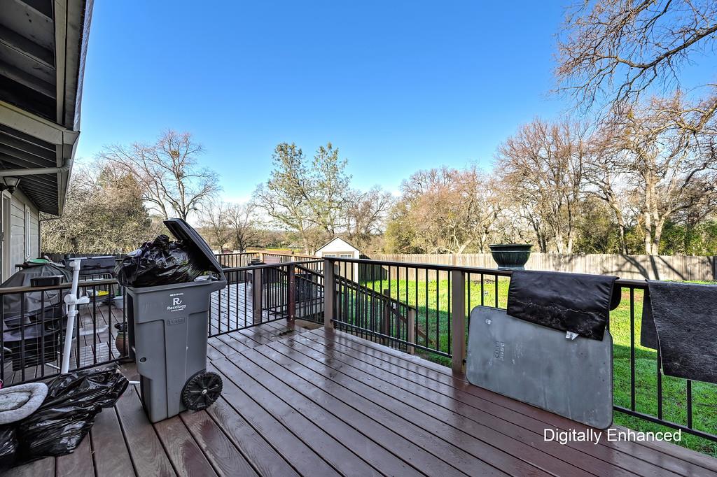 11425 Joeger Road Auburn, CA 95602 - Photo 17 of 52 a view of a deck with couches with wooden floor and fence
