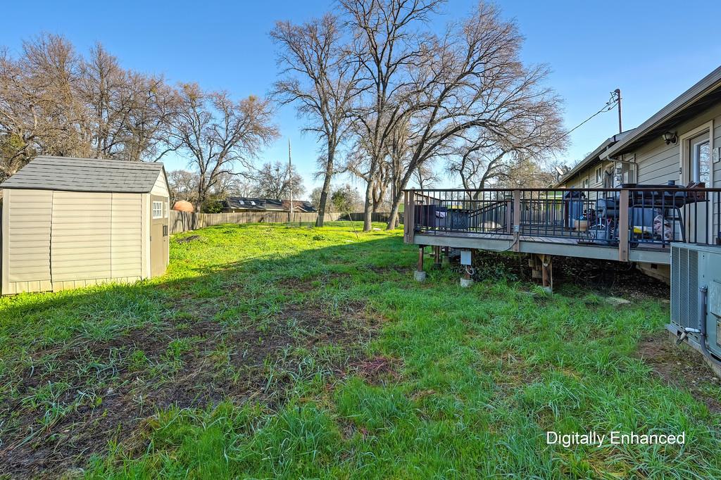 11425 Joeger Road Auburn, CA 95602 - Photo 19 of 52 a backyard of a house with wooden deck and large tree