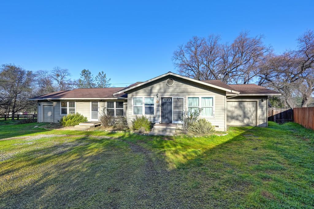 11425 Joeger Road Auburn, CA 95602 - Photo 3 of 52 a front view of a house with a yard table and chairs