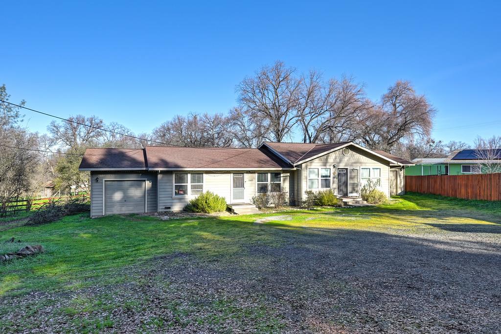 11425 Joeger Road Auburn, CA 95602 - Photo 41 of 52 a front view of a house with a yard and trees
