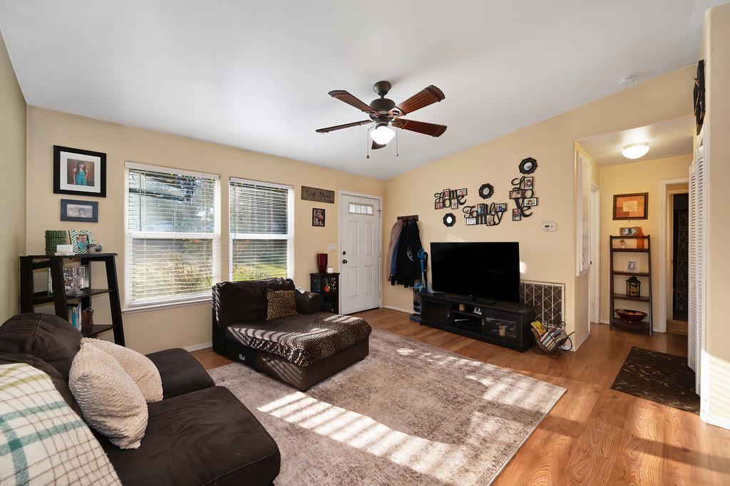 11425 Joeger Road Auburn, CA 95602 - Photo 7 of 52 a living room with furniture ceiling fan and a window