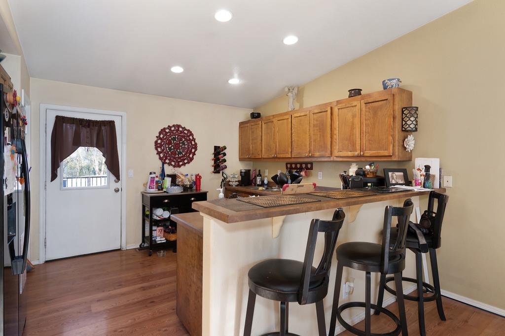 11425 Joeger Road Auburn, CA 95602 - Photo 9 of 52 a kitchen with a sink cabinets and window