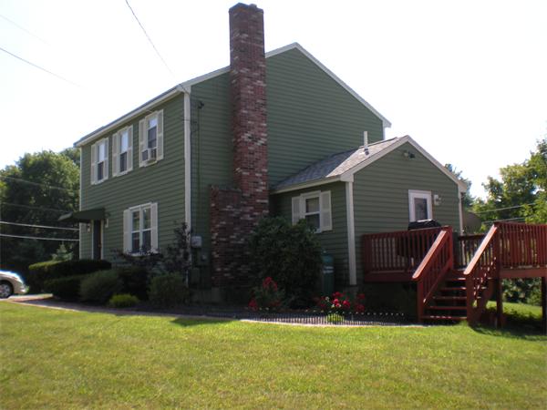 2 Morrison Road Windham, NH 03087 - Photo 2 of 10 a front view of a house with garden