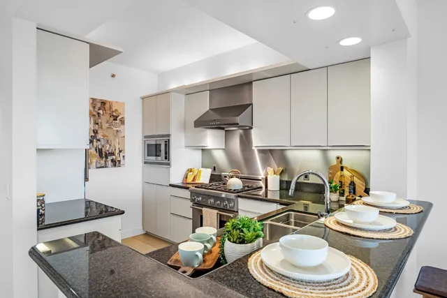 a kitchen with a table and chairs in it