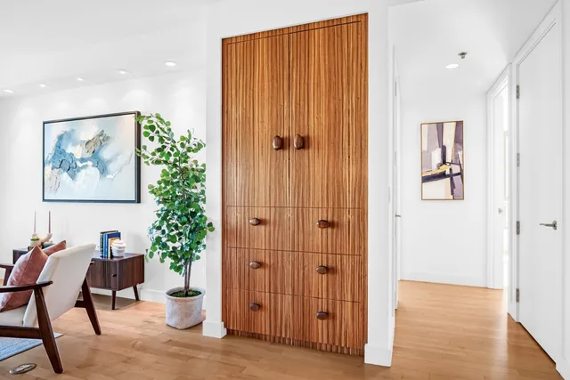 a view of room with furniture and wooden floor