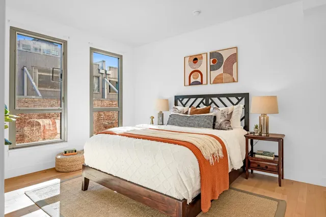 a bedroom with bed and window