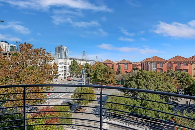a view of a city from a balcony with city view