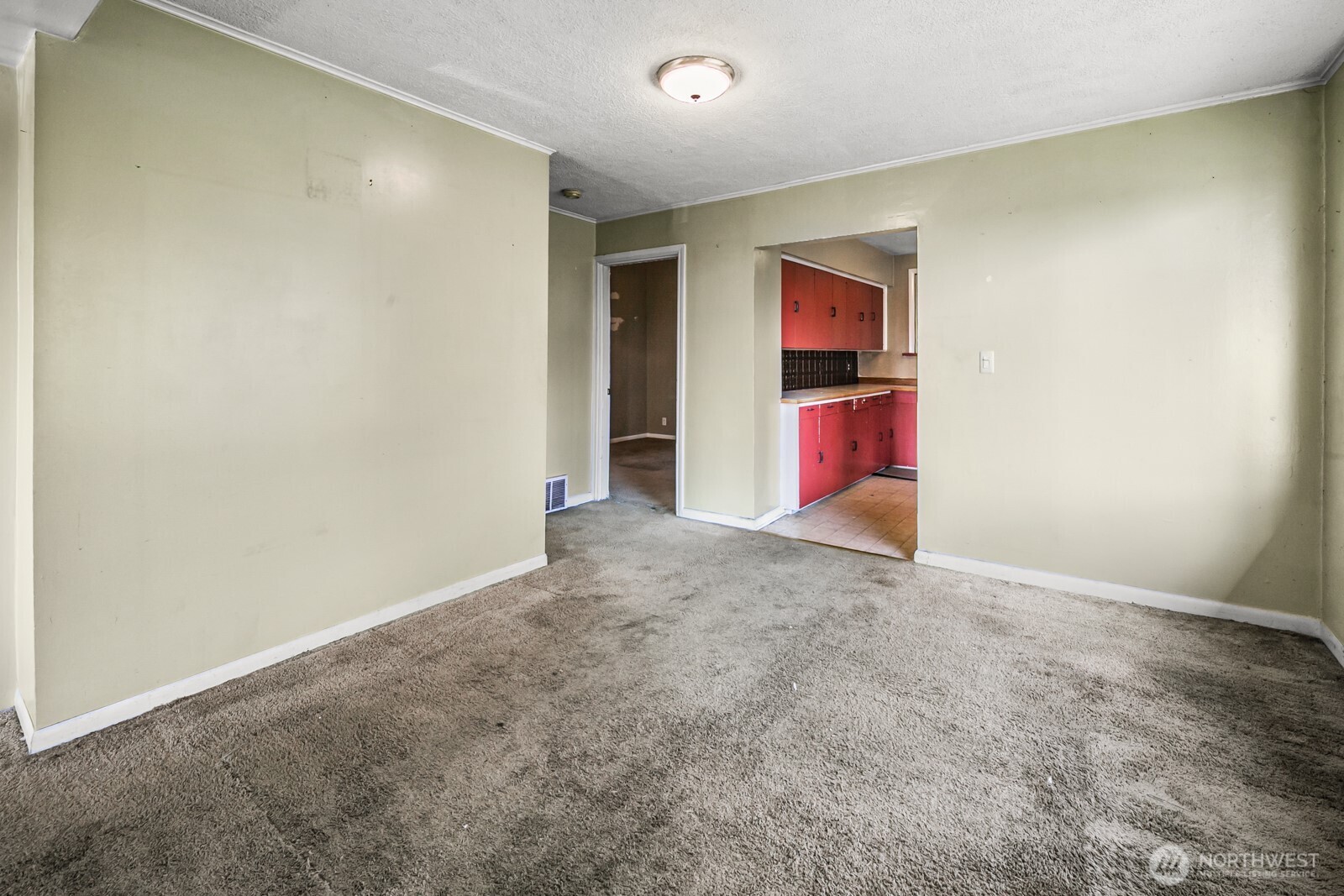 946 North 86th Street Seattle, WA 98103 - Photo 12 of 26 an empty room with wooden floor and glass door