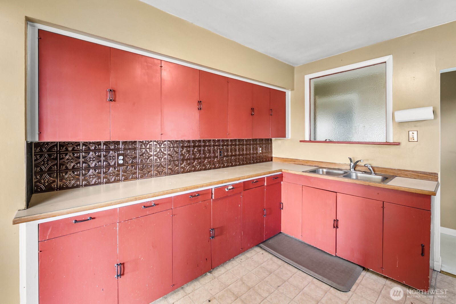 946 North 86th Street Seattle, WA 98103 - Photo 6 of 26 a bathroom with a sink and a mirror