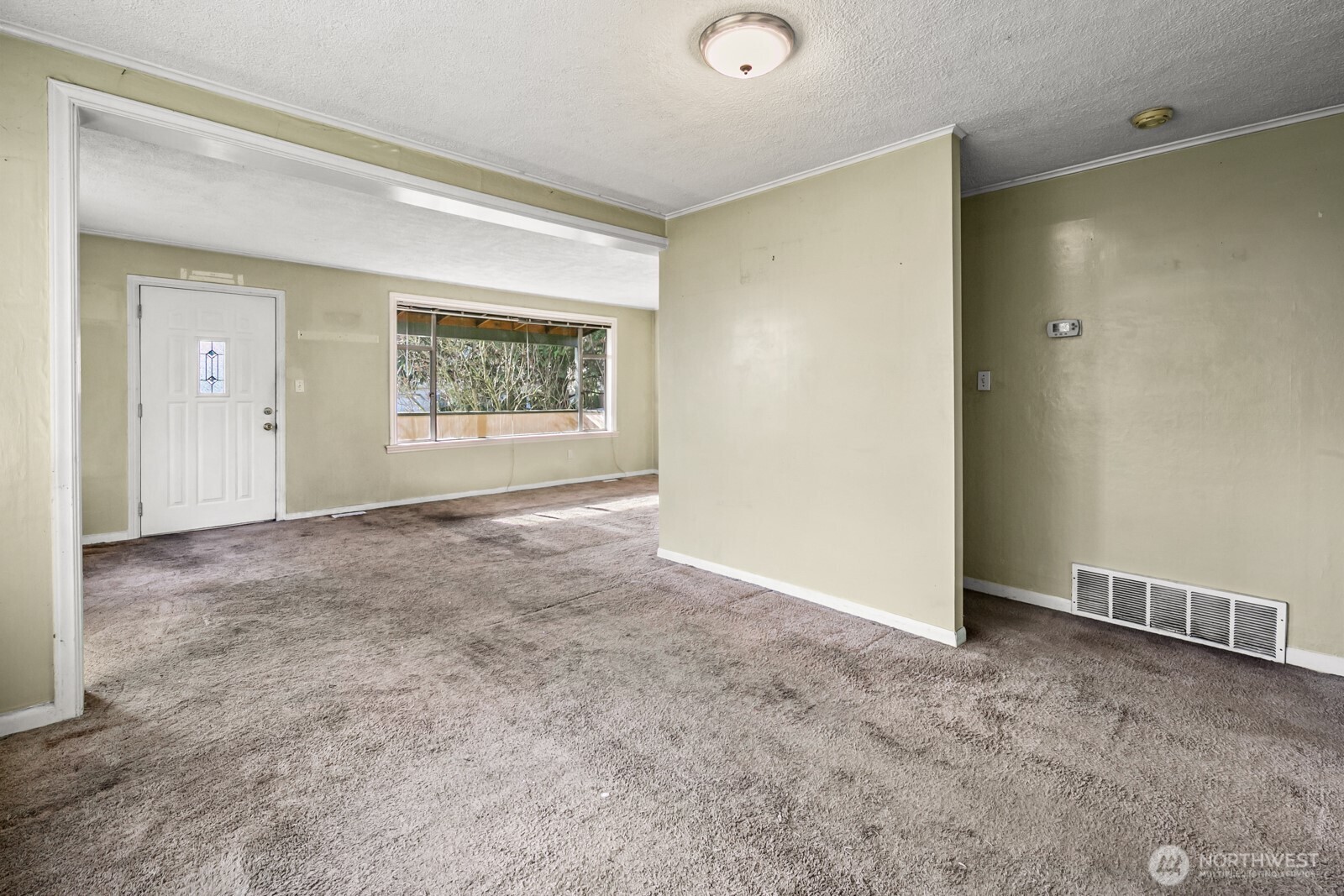946 North 86th Street Seattle, WA 98103 - Photo 8 of 26 an empty room with windows and closet