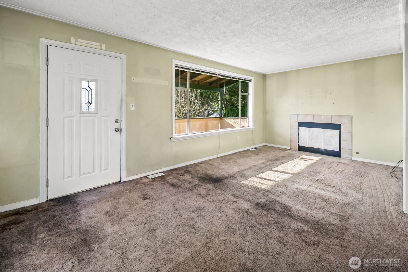 946 North 86th Street Seattle, WA 98103 - Photo 9 of 26 a view of an empty room with a window