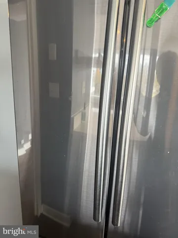 a view of a kitchen with a sink and a large window