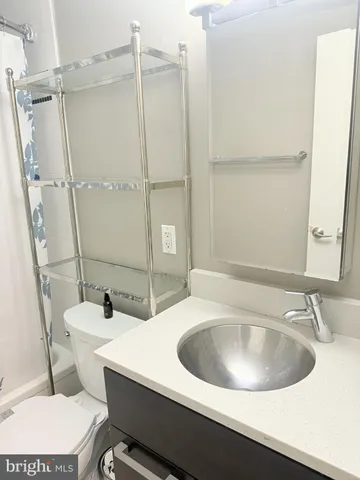 a close up of a sink and a mirror