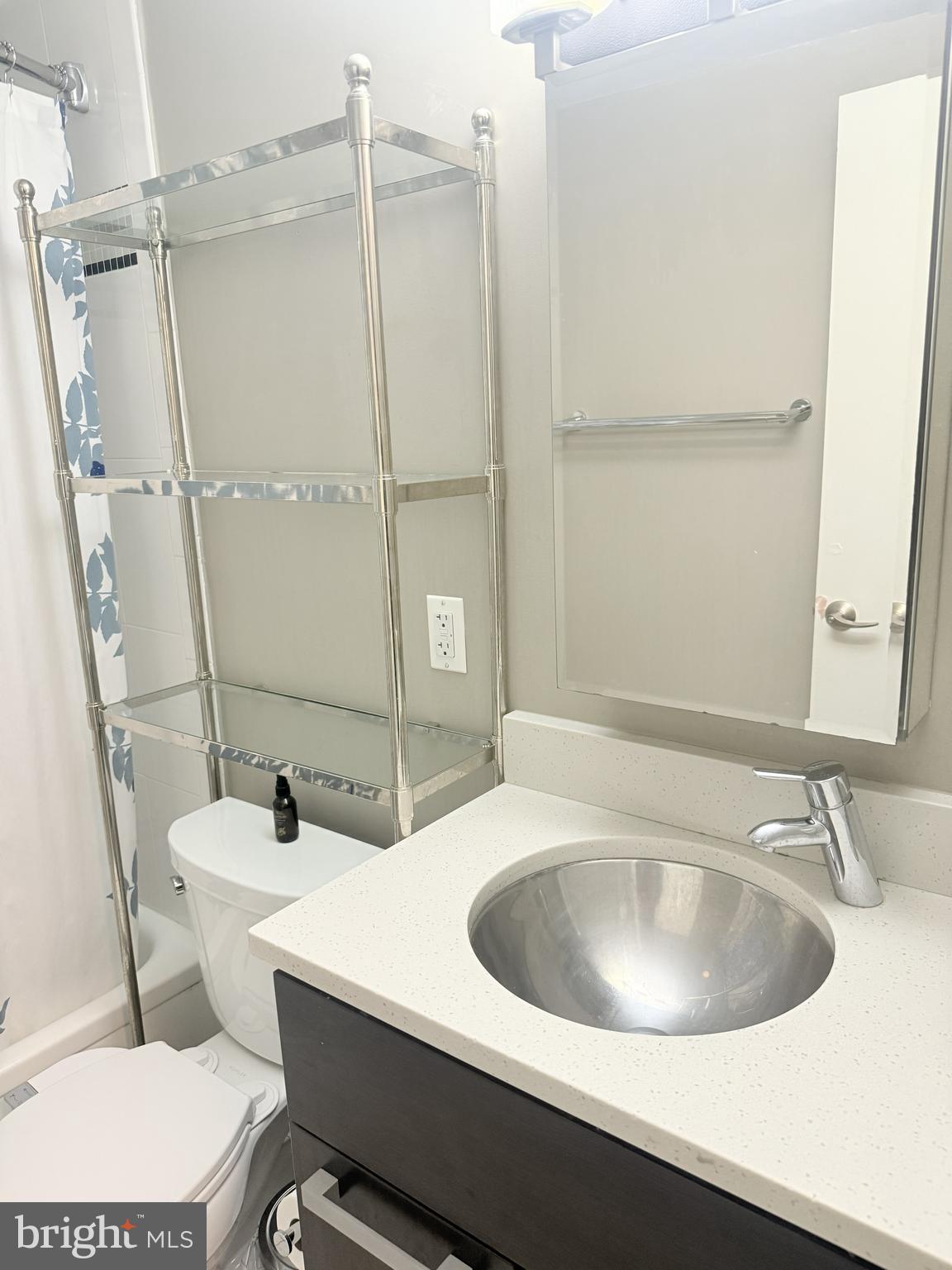 1101 3rd Street Southwest, Unit 306 Washington, DC 20024 - Photo 34 of 53 a bathroom with a sink and a toilet